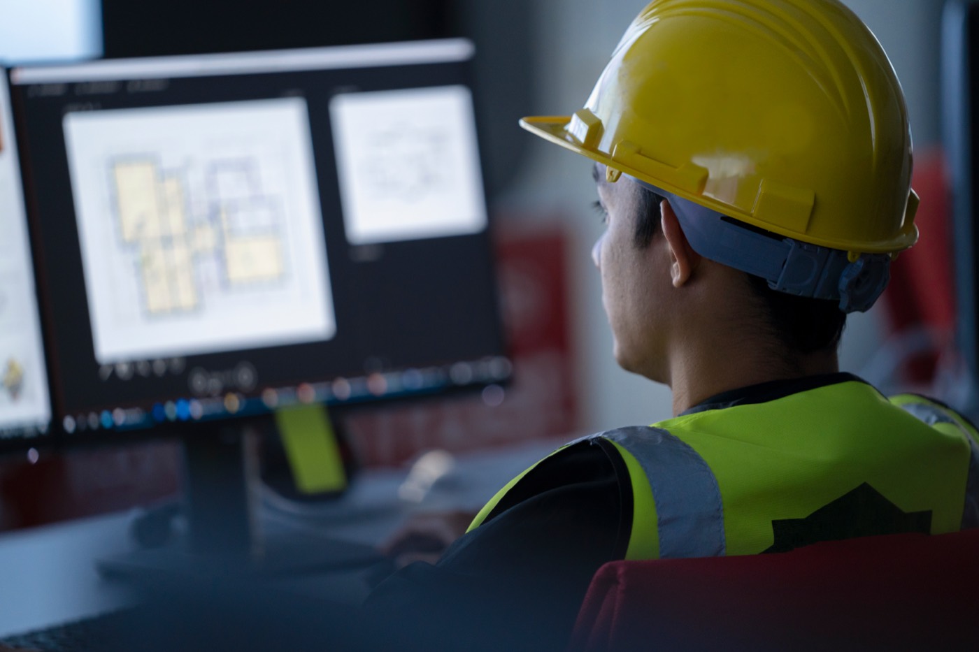 Engineer reading operating data on screen