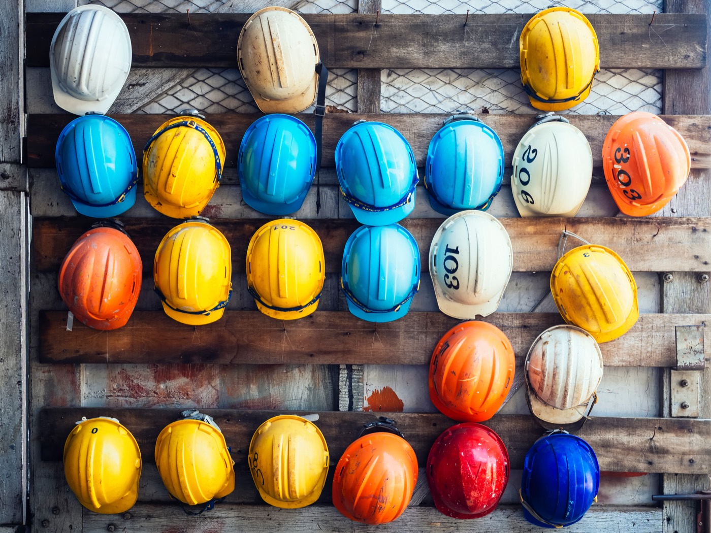 Hard hats on the rack at shift change
