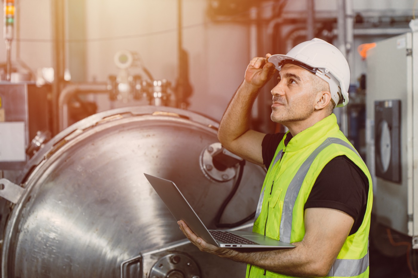 Engineer checking a large process vessel