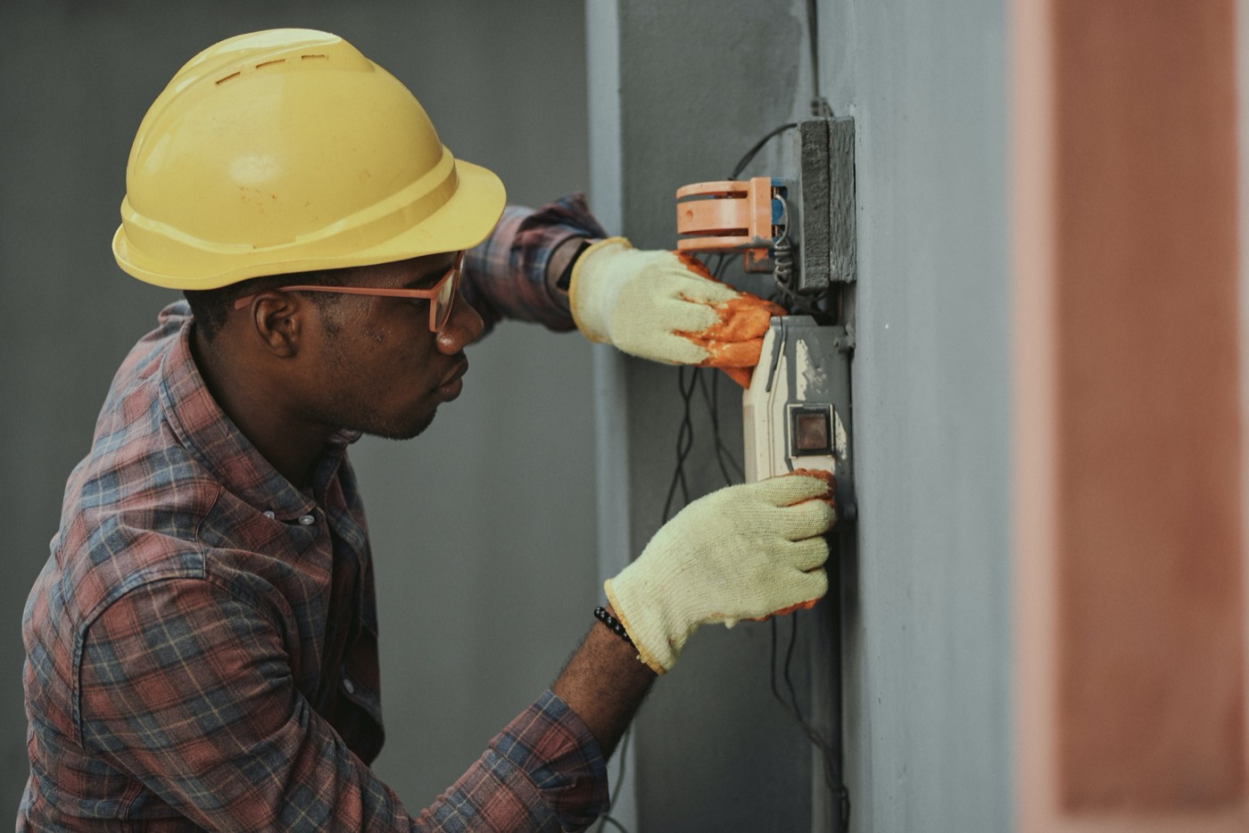 Technician wiring a field panel