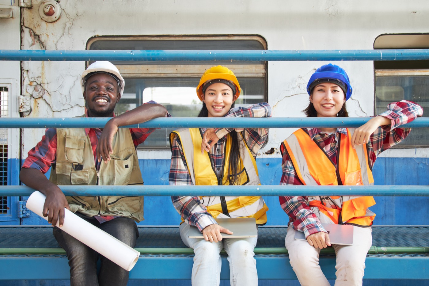 A crew with drawings on site